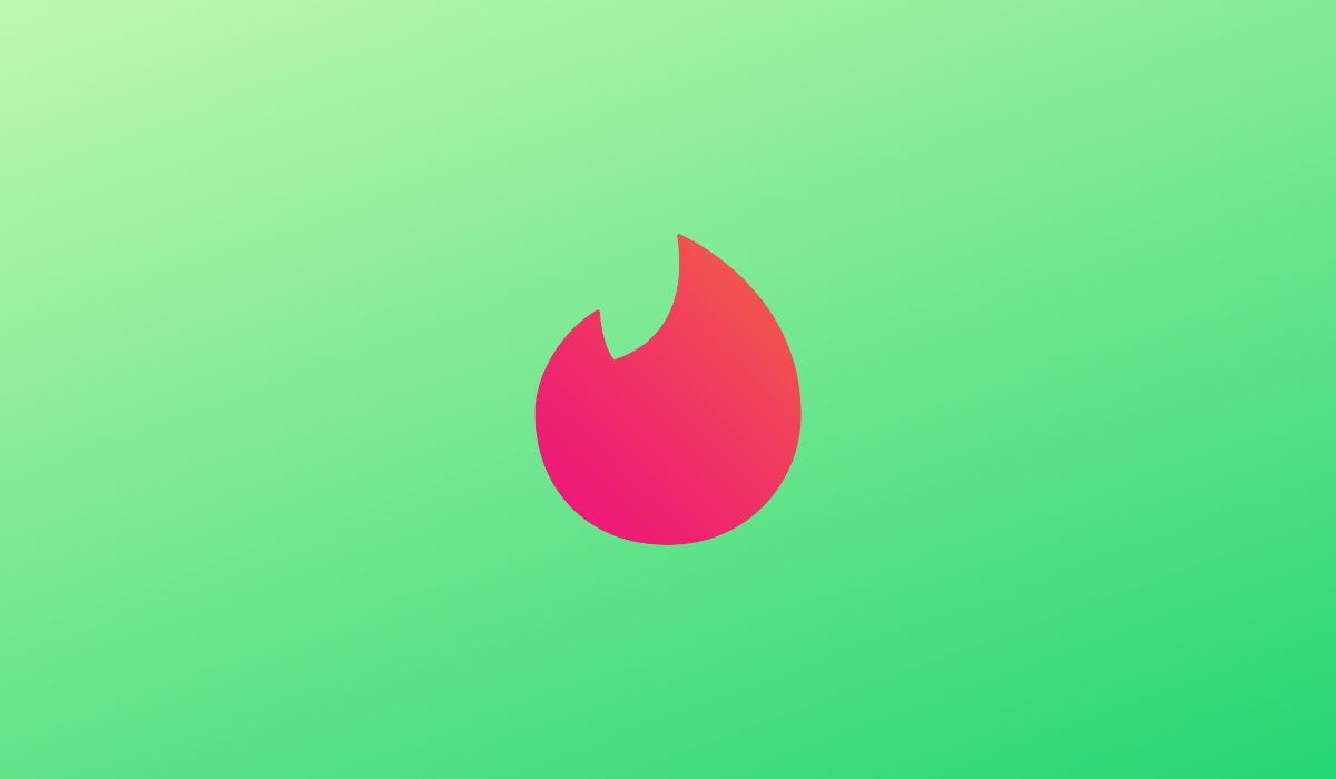 Tinder logo is seen on a green background